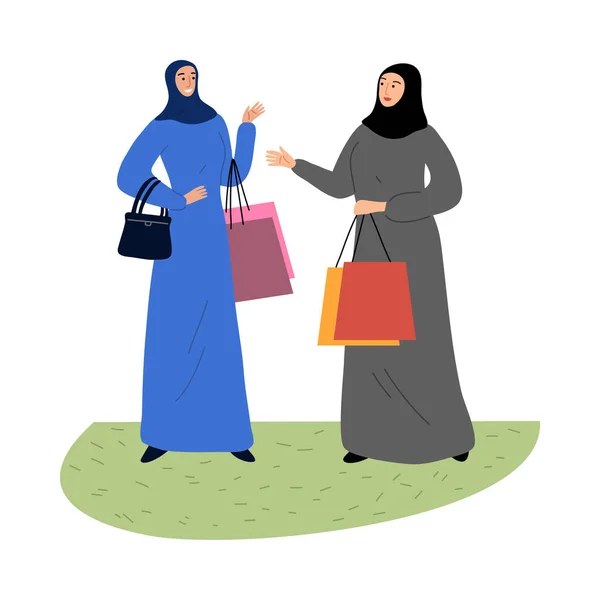 Meninas muçulmanas em um hijab étnico tradicional em pé com sacos de compras. Ilustração vetorial em estilo de desenho animado plano . —  Vetores de Stock