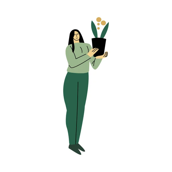 快乐微笑的生态志愿者女人穿着绿色的衬衫，站在一个装饰房子的盆栽。卡通风格的矢量图解. — 图库矢量图片