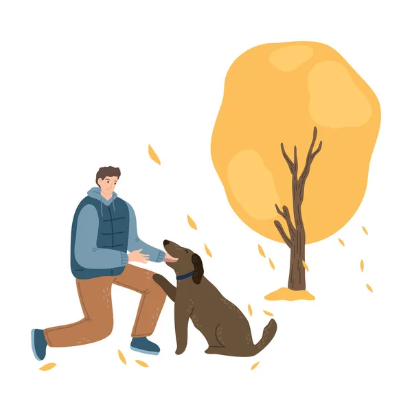 Man wandelen en trainen hond en genieten van het leven in het najaar park — Stockvector