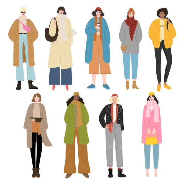 Joukko tyttöjä yllään eri tyylikäs päällysvaatteet syksyllä — vektorikuva