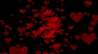 Soyut hareket arka planı parlayan kalp parçacıkları. Şeffaf bokeh. Kusursuz 4K döngü video animasyonu. Açık pembe parıltılı ışıklar, çözülmüş ışık yansımaları döngüye girebilir bokeh arkaplan.