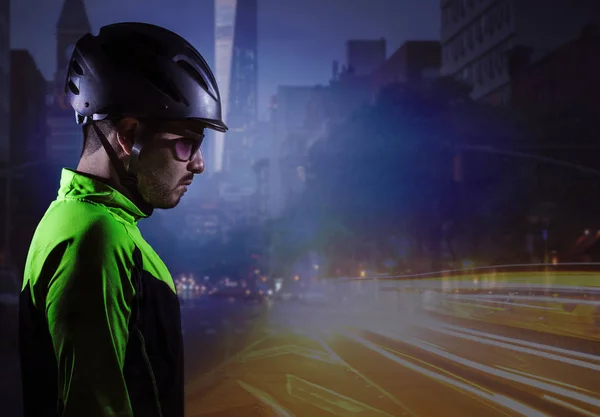 Young cyclist profile with urban scene in background