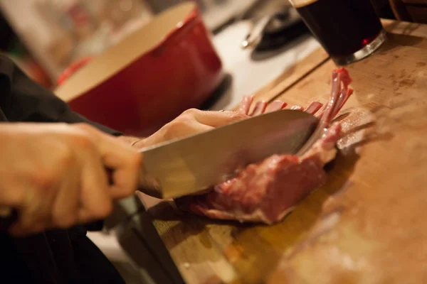 Closeup chef carving meat