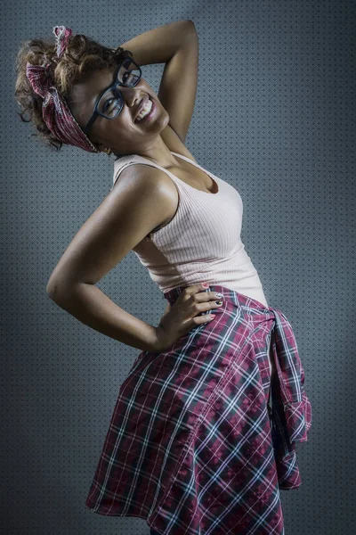 Portrait of a beautiful hipster woman on studio