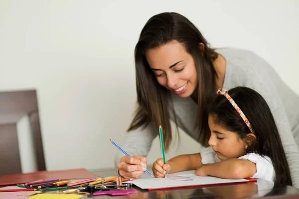 Mom and daughter doing homework together