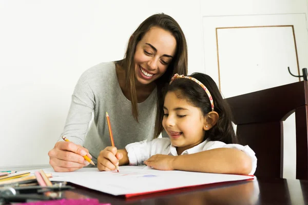 Mom and daughter doing homework together