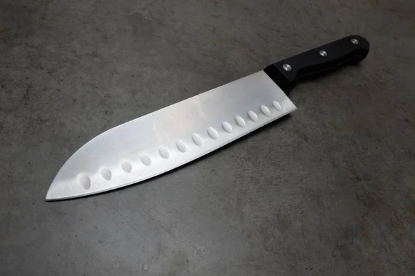 Coltello da chef su un tavolo grigio scuro — Foto Stock