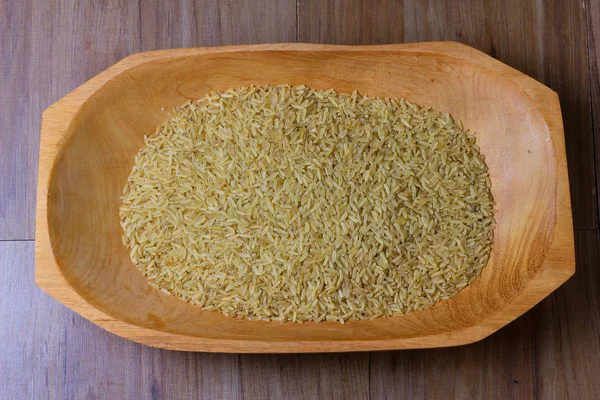 Portion Raw Brown Rice Wooden Bowl Wooden Table Top View — Stock Photo, Image