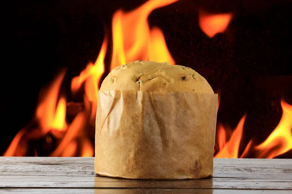 Panettone Decorative Food Wooden Table Fire Background Front View — Stock Photo, Image