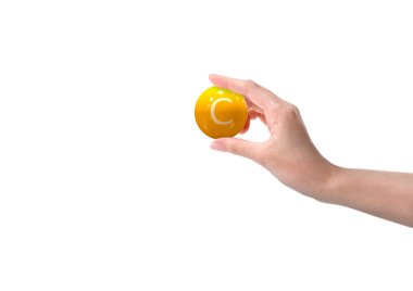 woman hand holding vitamin c capsule, orange color, on white background. Copy space. 3D rendering