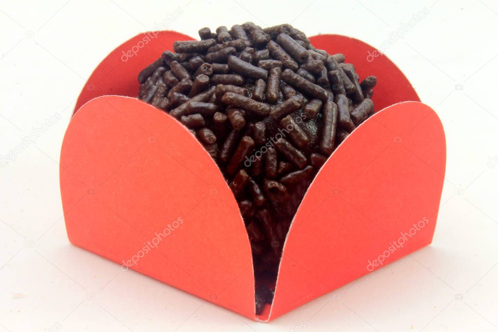 brigadeiro (brigadier), chocolate sweet typical of Brazilian cuisine covered with particles, in a white background