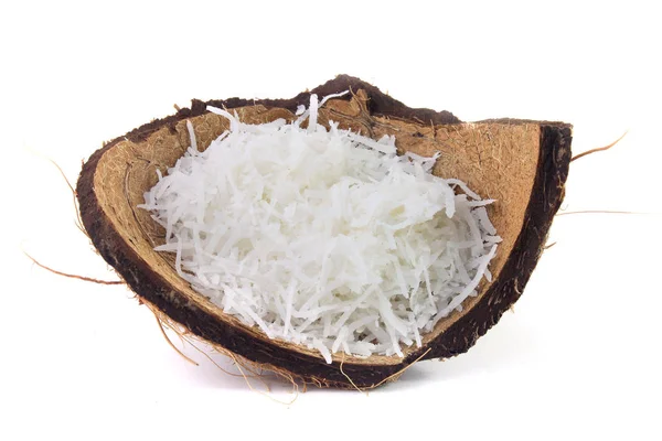 Fresh coconut flakes placed in bark and shell isolated on white background — Stock Photo, Image