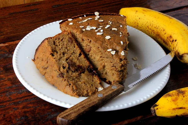 Healthy homemade banana cake made with oatmeal on rustic wooden table. sugar-free, milk-free, gluten-free