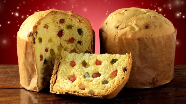 Italian Panettone Decorated Christmas Table Red Background Glowing Lights Particles — Stock Video