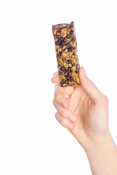 Woman holding grain cereal bar on white — Stock Photo, Image