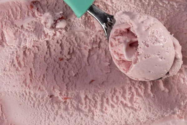 Strawberry ice cream with scoop