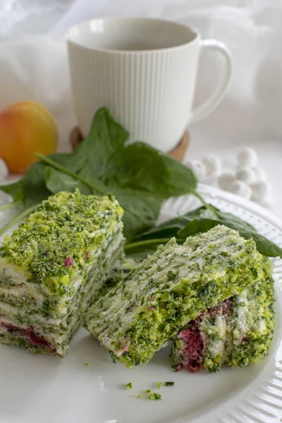Spinach and raspberry cake with a cup of aromatic coffee. Beautiful and romantic breakfast