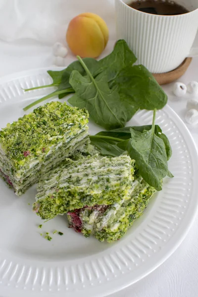 Spinach and raspberry cake with a cup of aromatic coffee. Beautiful and romantic breakfast