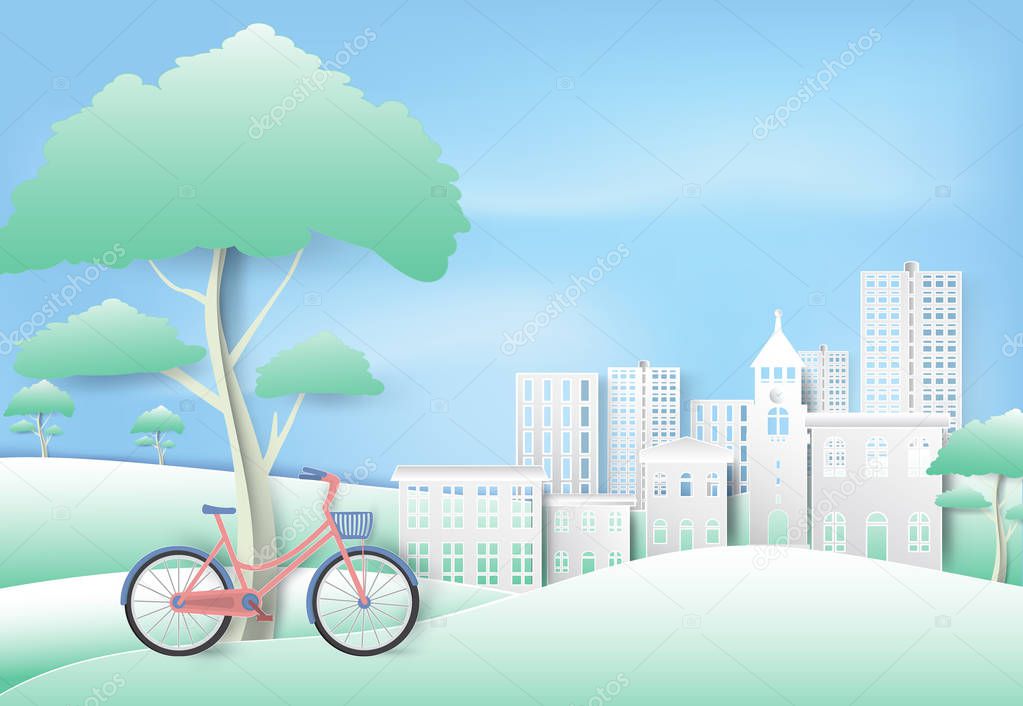 Bicycle under the tree in park on blue sky paper art, paper cut style background