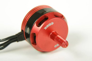 Small brushless motor for racing drones on the white background clipart