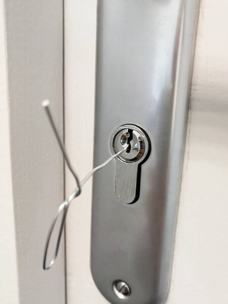 Small metal wire inserted in the keyhole of the door for unlocking doors without key