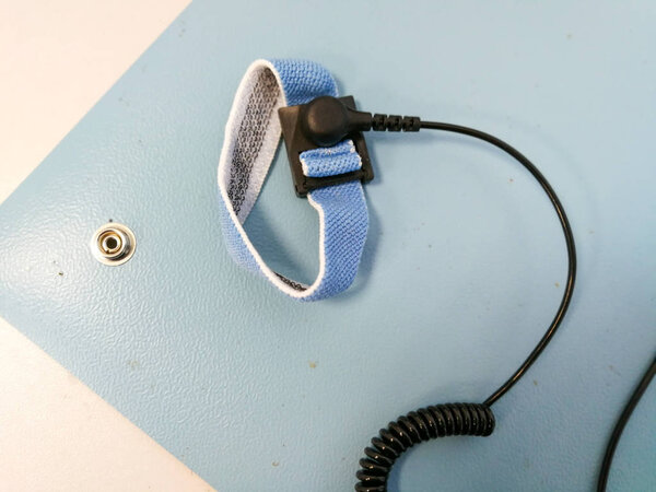 Electrostatic Discharge ESD bracelet on ESD mat. Protection against static electricity that damage electronics
