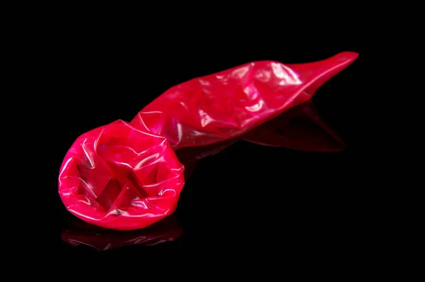 Used Pink Condom Close Sex Isolated Black Reflective Background — Stock Photo, Image