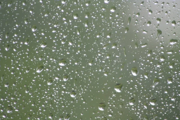 Gotas Agua Sobre Vidrio Sobre Fondo Verde —  Fotos de Stock