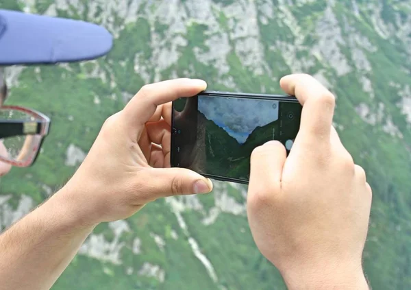 Man Holds Modern Smartphone His Hands Takes Pictures Mountains — Stock Photo, Image