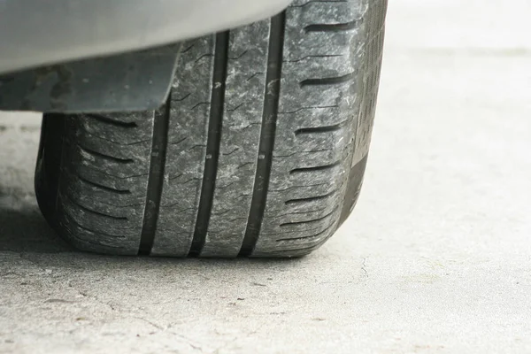 car tire tread and tread depth. vehicle tire. Tire wear concept. Danger of using old car bald tire.