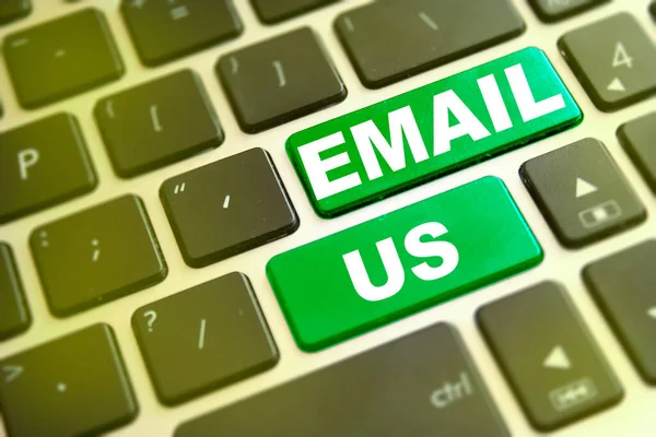 Note EMAIL US writting on green button on computer keyboard. Contact page for support or help concept background