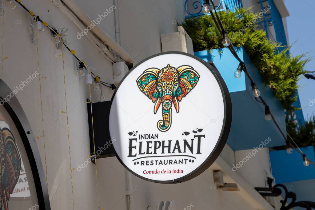 Altea Spain - July 17 2025: Colorful sign of the Indian Elephant restaurant featuring a decorative elephant illustration enhancing the dining atmosphere.