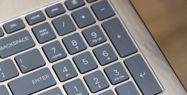 Close-up of a laptop numeric keypad showcasing its layout and design. Ideal for tech-related projects this image emphasizes functionality and modern technology.