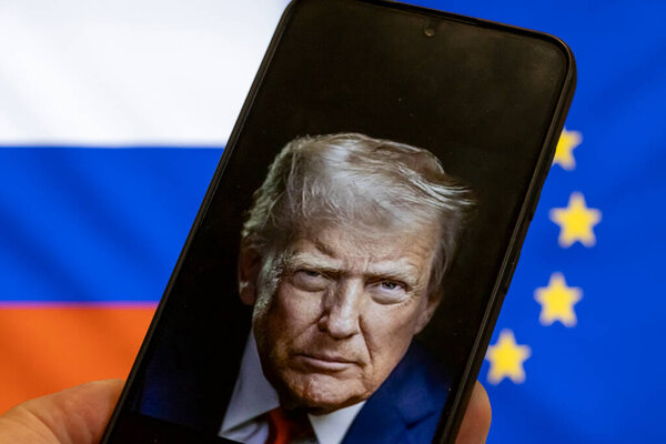 Warsaw Poland - September 17 2025: A smartphone displays a portrait of Donald Trump against a backdrop of Russian and European Union flags symbolizing geopolitical tensions.