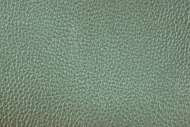 Açık yeşil deri kaplama. Büyük tanelerin yakın görüntüsü