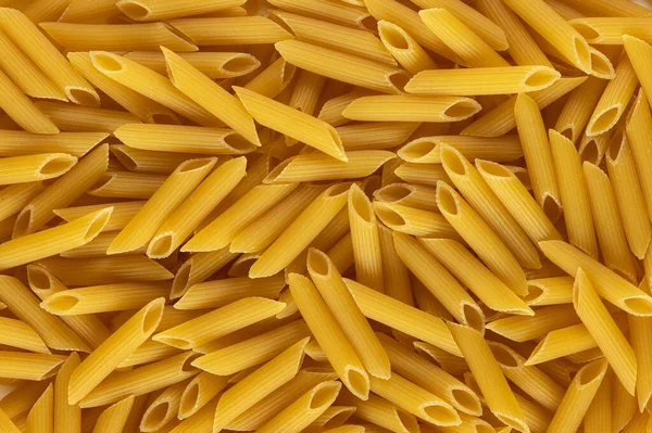 Gruppe Von Penne Rigate Form Der Italienischen Pasta Als Hintergrund — Stockfoto