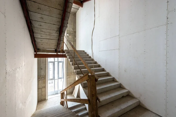 Construction zone on stairs of future house