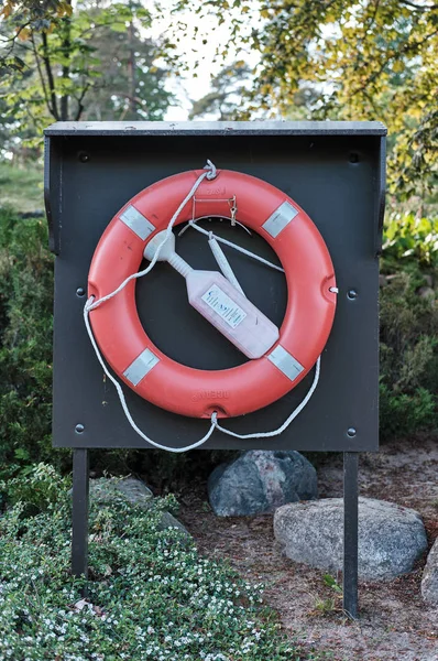 Lifebuoy Ring. In park with lake