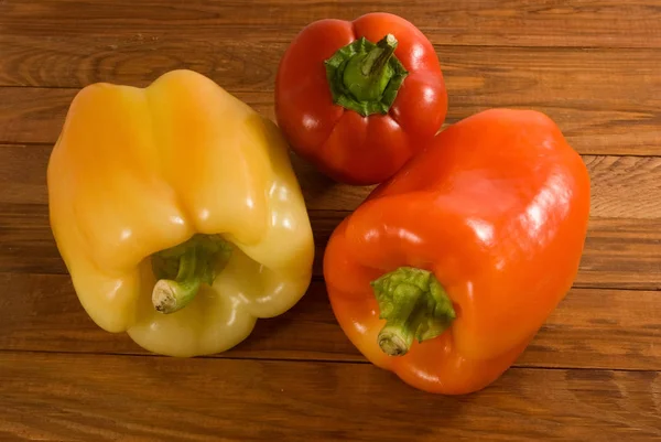 three peppers on the table