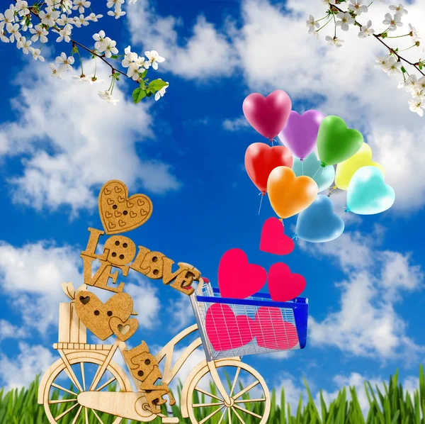 Obrázek stylizované dřevěný muž, kolo a balónky v zahradě. — Stock fotografie