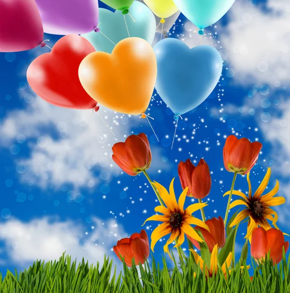 Flowers and festive balloons against the sky close-up — Stock Photo, Image