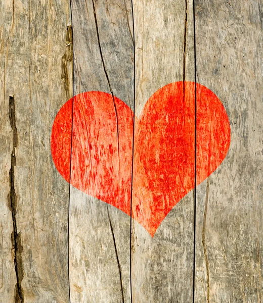 Srdce na dřevěném prkénku — Stock fotografie