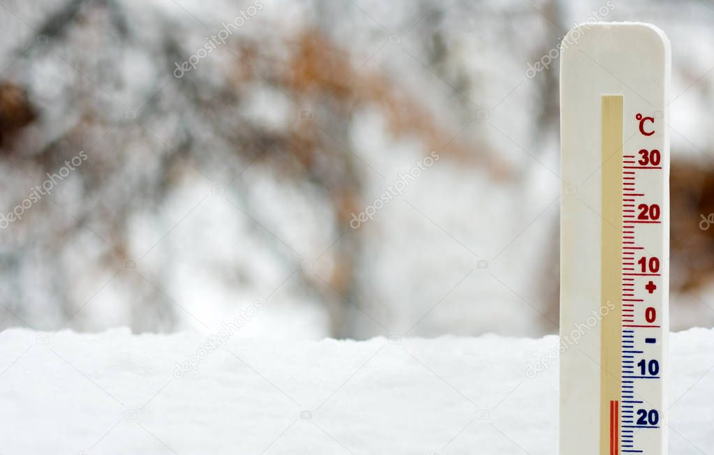image of a thermometer in snow