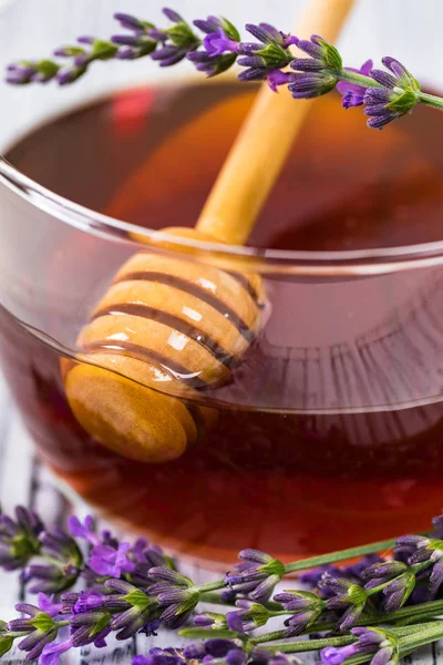 Lavender Herbal Honey with Lavender Flowers. Selective focus.