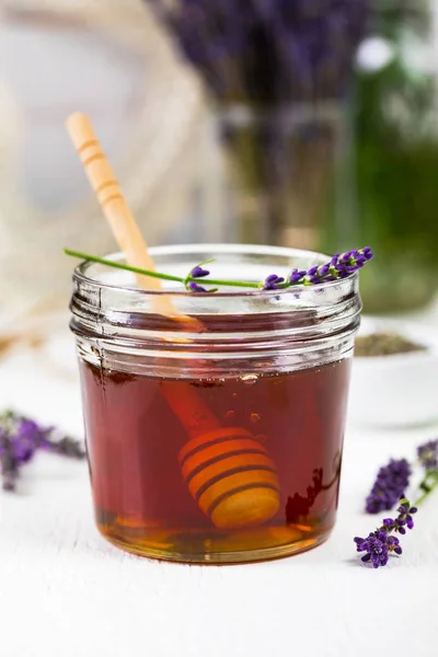 Lavender Herbal Honey with Lavender Flowers. Selective focus.