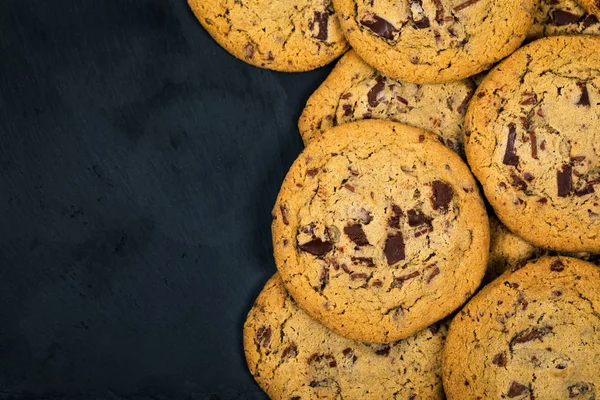 Chocolate Chip Cookies on Black Background. Selective focus.