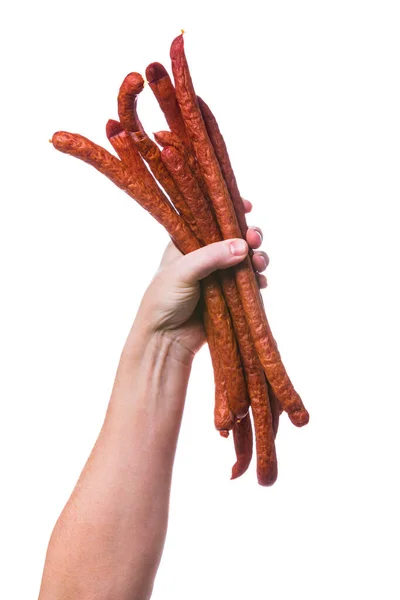 Man Holding Kabanos or Cabanossi Thin Dry Smoked Polish Sausage Isolated on White background. Selective focus.