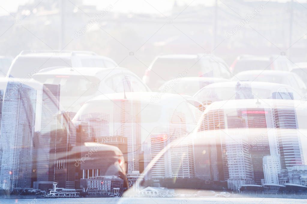 city life double exposure, traffic jam, cars on the road and modern skyline