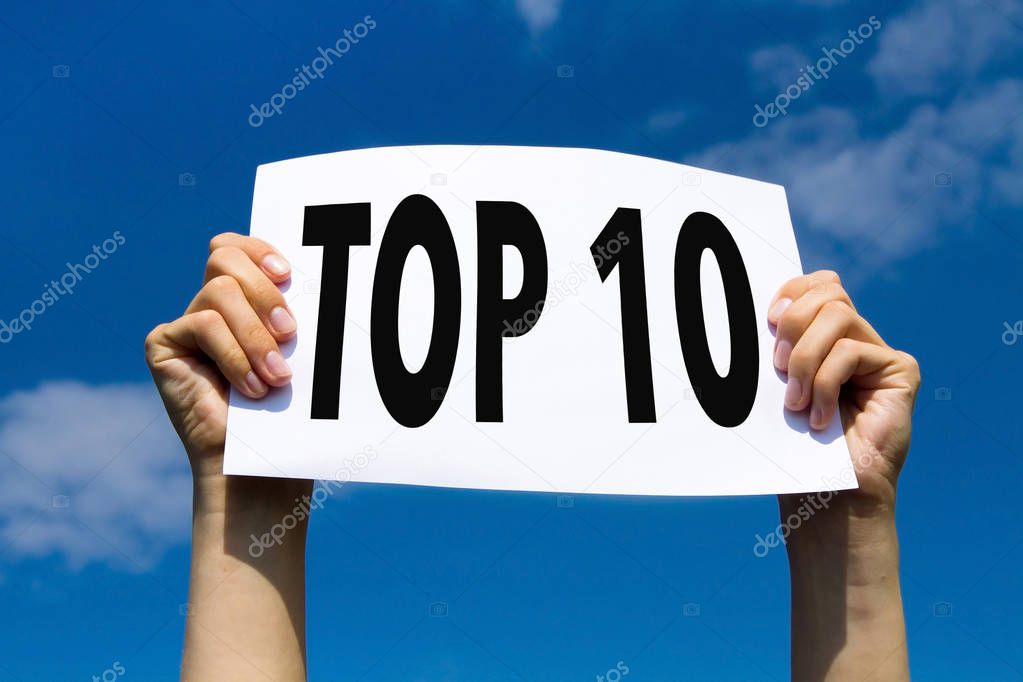 top 10, hands holding sign in blue sky