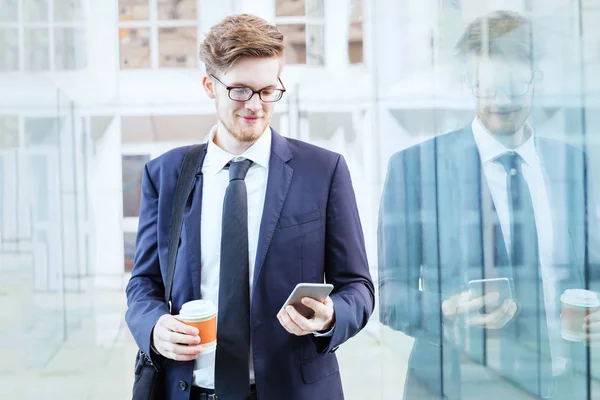 Businessman Using Smartphone Drinking Coffee Modern Bright Interior Office Glass — Stock Photo, Image